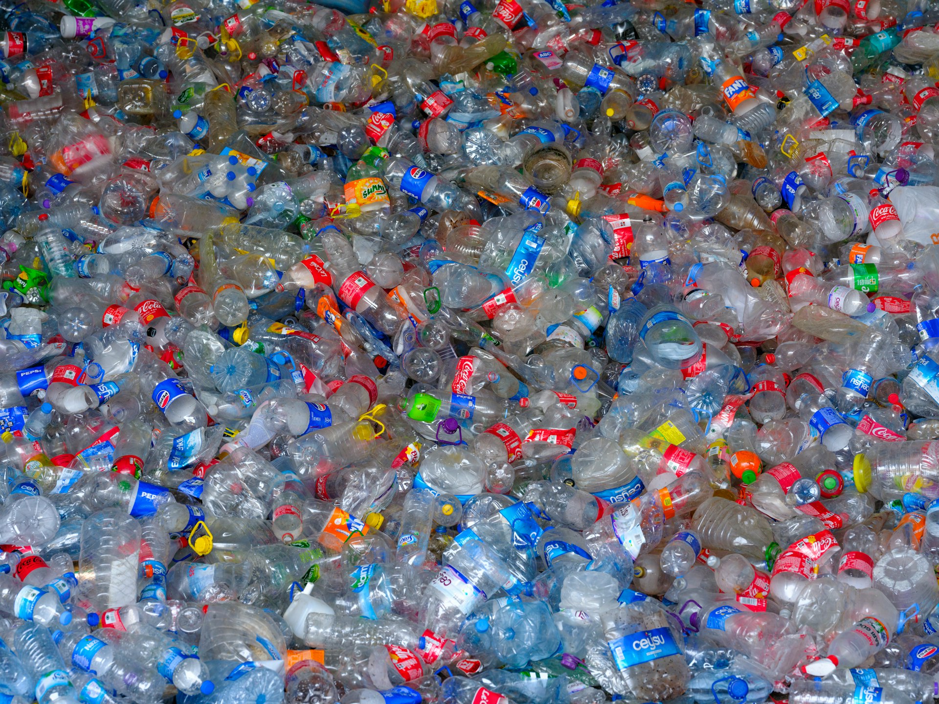 A pile of plastic bottles filled with water